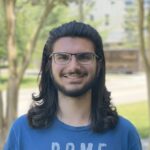 Dev Chary in a blue shirt.