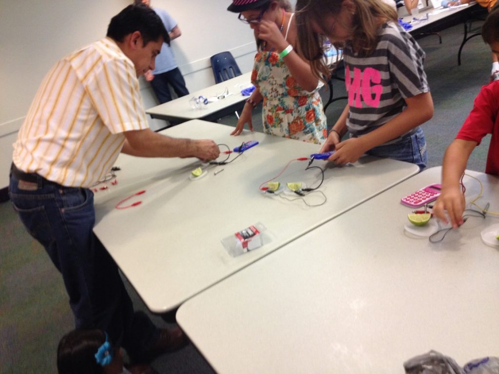 Participants engaged in an interactive electronics workshop.